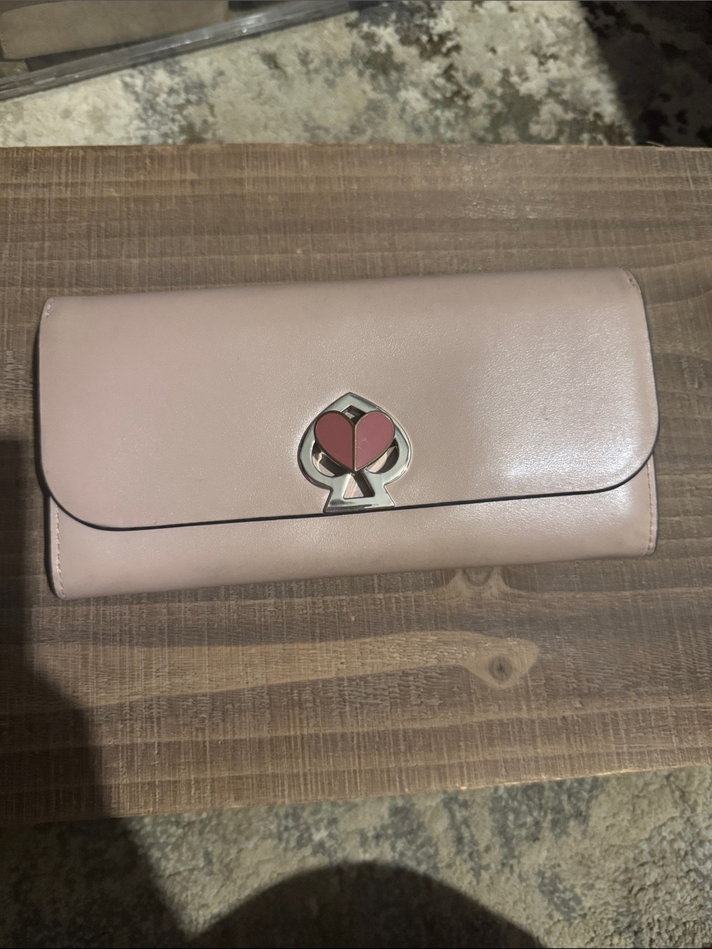 kate spade pale pink leather continental wallet with spade-heart emblem